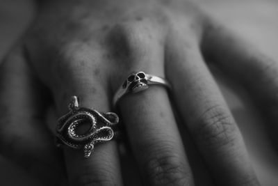 Cropped hand of woman holding ring