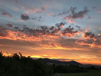 Scenic view of dramatic sky during sunset