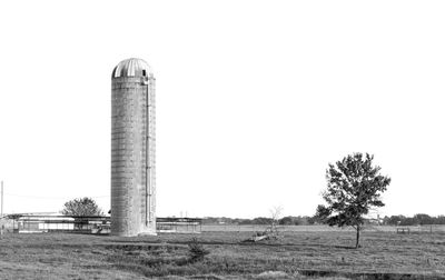 Built structure on field against clear sky