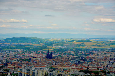 Aerial view of cityscape against sky