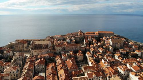 High angle view of townscape by sea