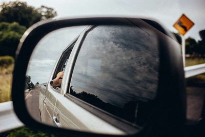 Close-up of car on road