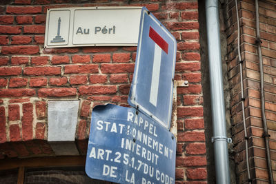 Information sign on brick wall