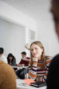 Portrait of smiling woman in class