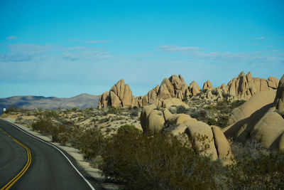 Panoramic view of mountain road against sky