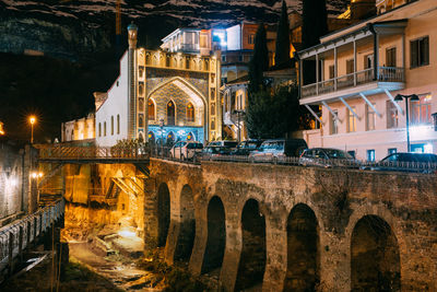 Illuminated buildings in city at night