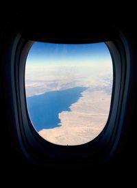Scenic view of landscape seen through airplane window
