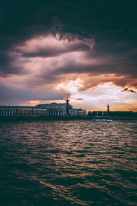 View of bridge over river against cloudy sky