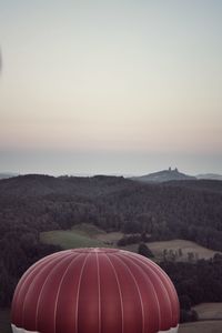 Scenic view of field against clear sky during sunset