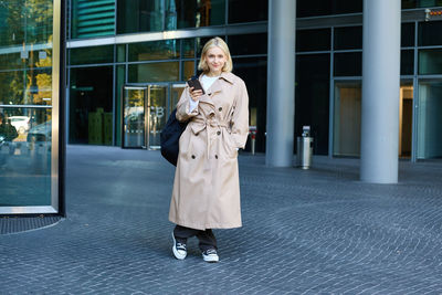 Young woman standing in city