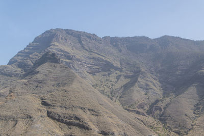 Scenic view of rocky mountains against clear sky