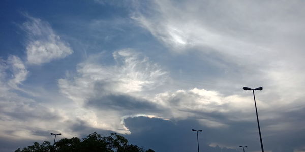 Low angle view of street light against sky