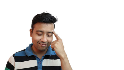 Portrait of young man against white background