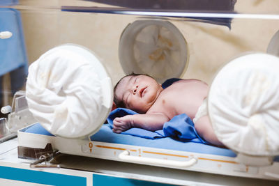 Newborn latin child in a incubator of a mexican hospital in mexico city