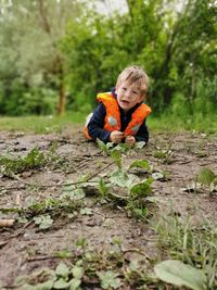 Full length of boy on field