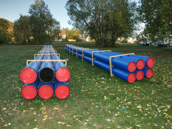 Hdpe pipe for water supply stacked at building site on ground. new branch of portable water for city