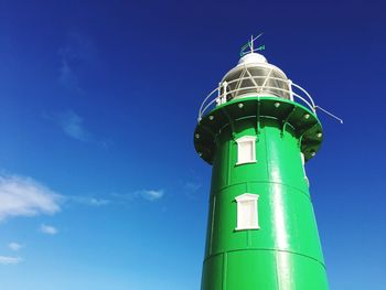 Low angle view of lighthouse against blue sky