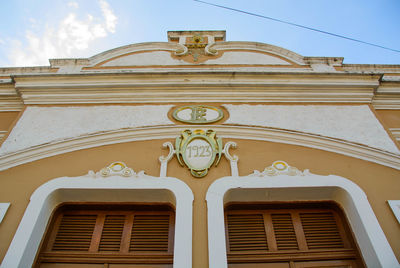 Low angle view of ornate building against sky