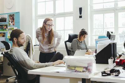 Creative business people working at desk in office