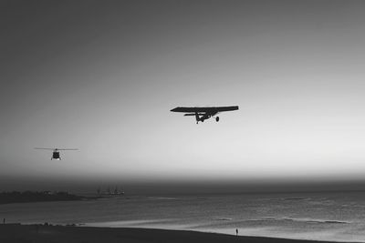 Low angle view of airplane flying in sky