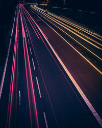 High angle view of light trails on highway at night