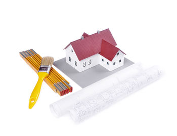 High angle view of multi colored pencils against white background