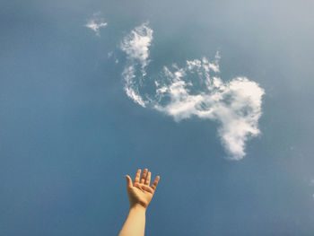 Low angle view of woman against sky