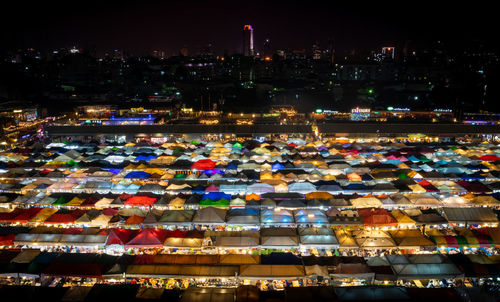 High angle view of illuminated buildings in city at night