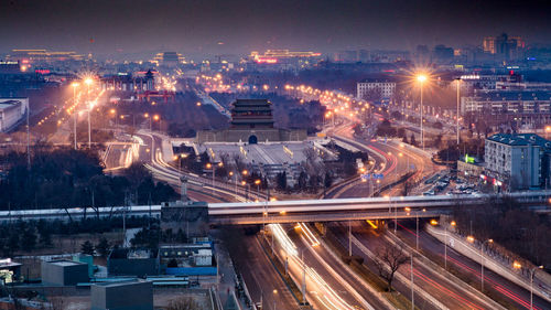 High angle view of light trails on city street at night