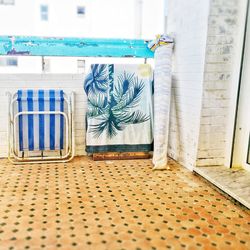 Close-up of chairs on table