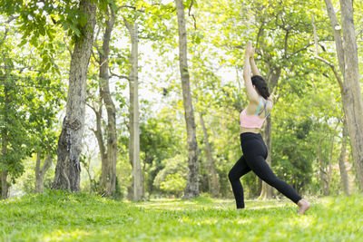 Woman exercising in a forest