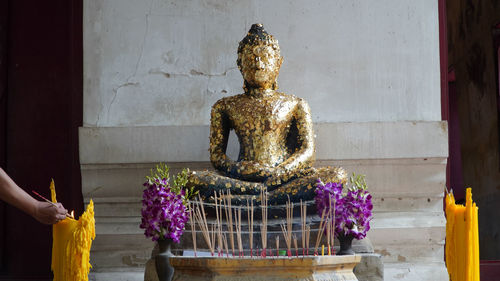 Statue of people outside temple