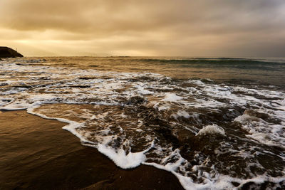 Scenic view of sea against sky during sunrise