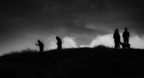 Silhouette of people at sunset