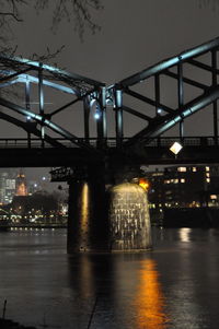Illuminated bridge at night
