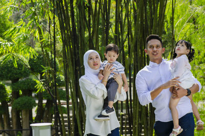 Full length of father and daughter in park