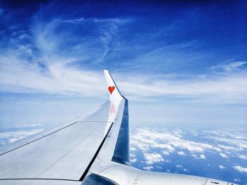View of landscape against blue sky and clouds