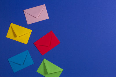 Low angle view of paper against blue sky