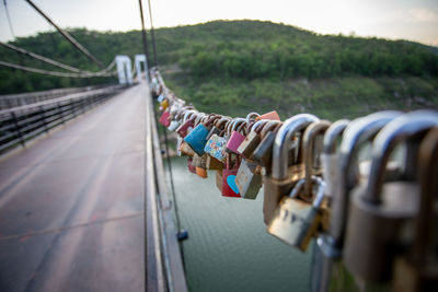 Close-up of padlocks on bridge