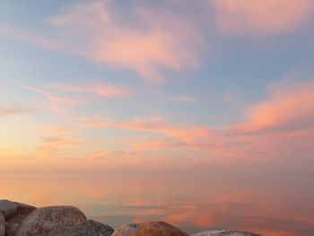 Low angle view of rocks against sky during sunset