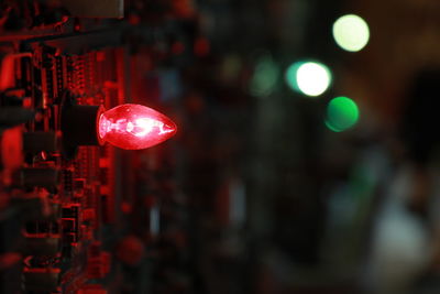 Close-up of illuminated lights at night