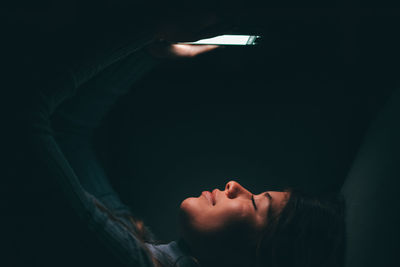 Low angle view of man against black background