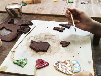 High angle view of man preparing food on table