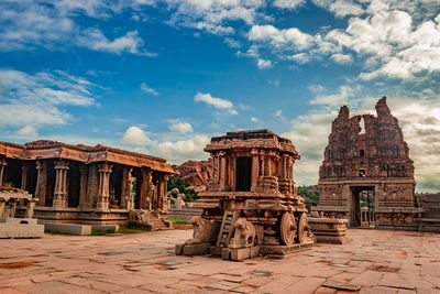 Old temple against cloudy sky