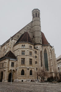 Low angle view of old building against clear sky