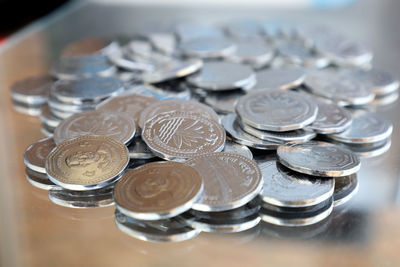 High angle view of coins on table