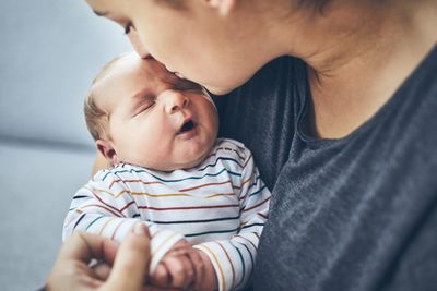 Midsection of father and daughter baby