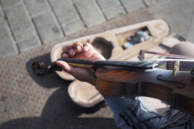 Midsection of man playing violin