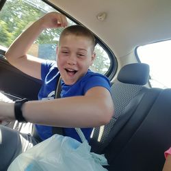 Boy sitting in car