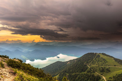 Scenic view of mountains against cloudy sky